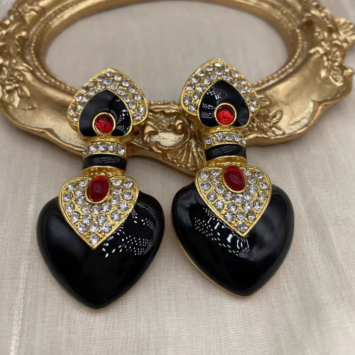 Black enamel with red colored glaze ethnic style clip earrings