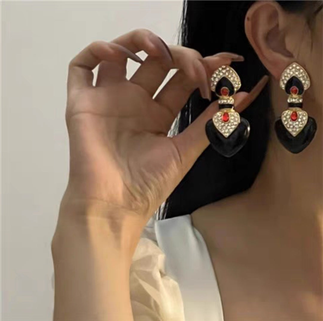 Black enamel with red colored glaze ethnic style clip earrings