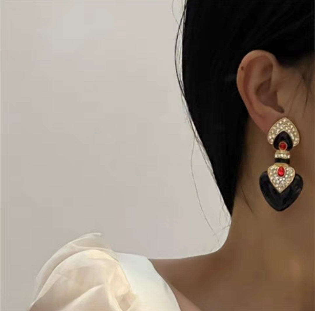 Black enamel with red colored glaze ethnic style clip earrings