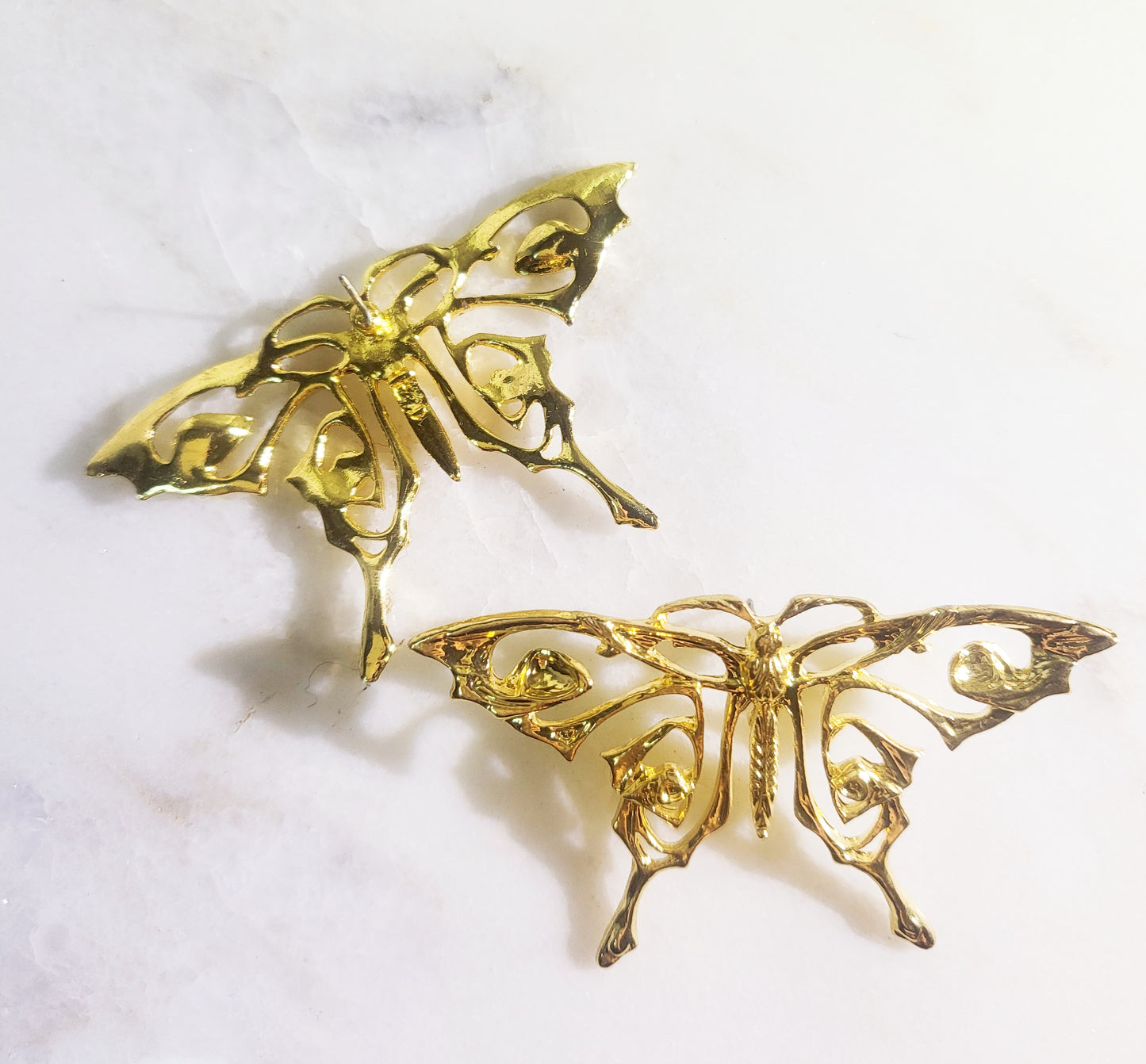 Planted gold butterfly earring