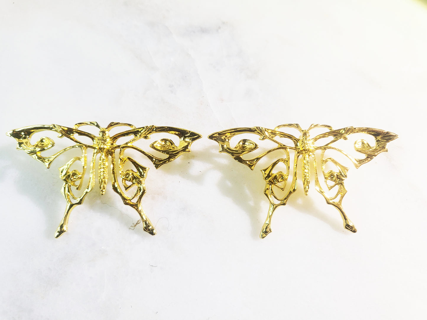 Planted gold butterfly earring